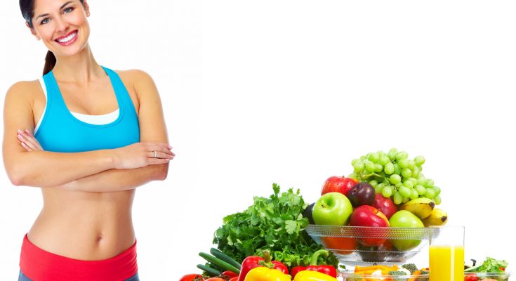 Young healthy woman with fruits.