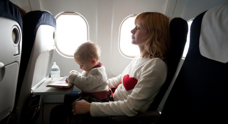 Mother with her baby boy in an aircraft