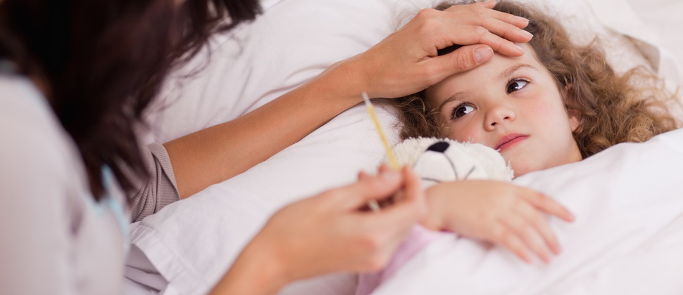 Mother taking care of her sick daughter