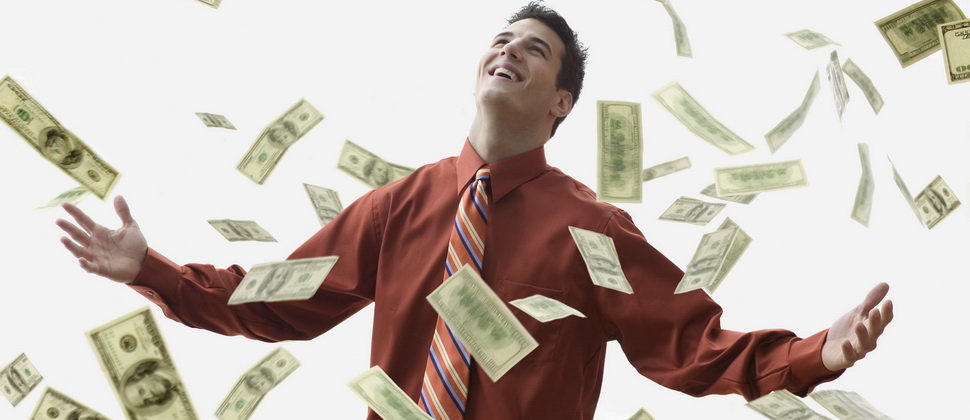 corbis - soldi - Money Falling on Happy Businessman --- Image by © JLP/Jose L. Pelaez/Corbis