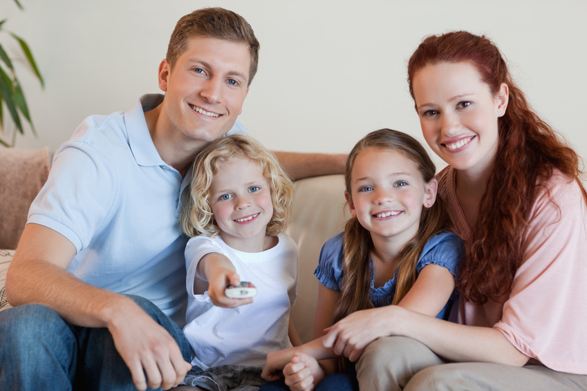 Family watching television together